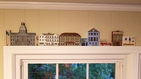 Deonna's Cat's Meow collection perched on the trim above her window, reflects the important moments in her life.