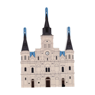 Model of a cathedral with black spires and blue accents on a white background