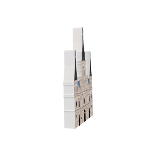 3/4" thick wooden illustration of a cathedral with spires on a white background