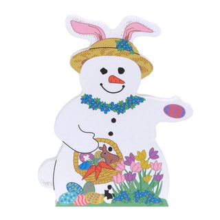 3/4" thick wooden replica with an Illustration of a white snowman Easter bunny with pink bunny ears, a yellow hat, a blue floral collar, and a basket holding a brown bunny, carrots, and colorful eggs, shown on a plain white background.