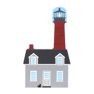 wooden replica with an Illustration of a red  lighthouse with a house attached 