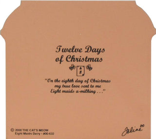  peach-colored back of product with black printed with the text 'Twelve Days of Christmas' and a holiday quote, plus small decorative illustrations. Visible text also includes '© 2000 THE CAT'S MEOW' and 'Eight Maids Dairy - #00-632' with a signature at lower right.