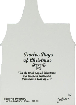 back of product with black printed text reading 'Twelve Days of Christmas' and a quote below, plus small decorative icons. The bottom includes copyright text for 'The Cat's Meow' toy shop and a signature.