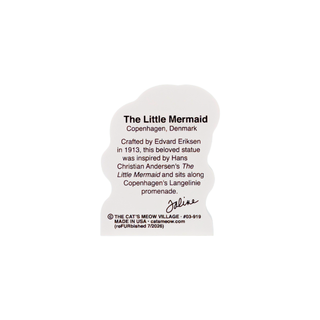 back of product featuring black text about 'The Little Mermaid' from Copenhagen, Denmark. The sign includes a short story, a signature, and copyright information for The Cat's Meow Village.
