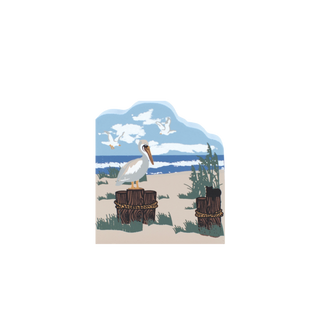 Decorative wooden replica with a pelican on a beach scene