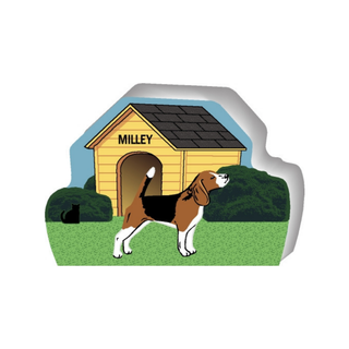 wooden replica of a illustrated black brown and white little dog standing in front of a dog house