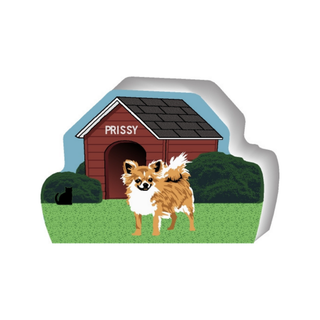 wooden replica of a illustrated little white and tan long haired dog standing in front of a dog house