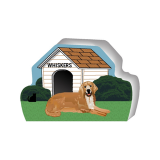 wooden replica of a illustrated tan golden retriever dog standing in front of a dog house