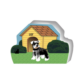 wooden replica of a illustrated black, grey and white dog standing in front of a dog house