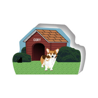 wooden replica of a illustrated corgi standing in front of a dog house