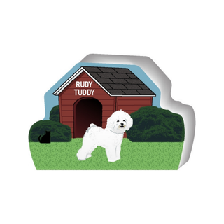 wooden replica of a illustrated little white fluffy dog standing in front of a dog house