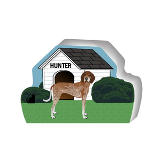 wooden replica of a illustrated redtick brown and white spotted dog standing in front of a dog house