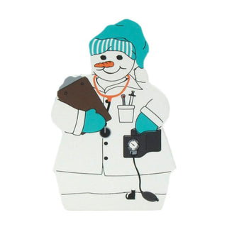 3/4" thick wooden replica with an Illustration of a snowman dressed as a doctor, wearing a teal and white striped nurse hat, teal gloves, and holding a stethoscope and clipboard, on a plain white background.