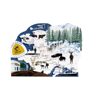 3/4" thick wooden Map of the Iditarod Trail with various elements including a dog sled race, mountains, and buildings.
