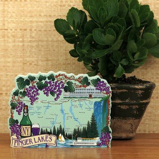 Finger Lakes region map 3/4" thick wooden cutout  on a wooden surface with a plant in the background