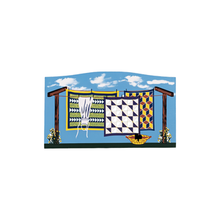 3/4" thick wooden illustration of a clothesline with quilts