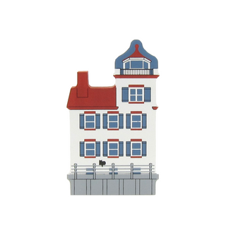 3/4" thick wooden  replica of a lighthouse with red and blue accents on a white background