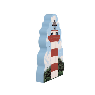 3/4" thick wooden  cutout of a lighthouse with a blue sky and clouds in the background