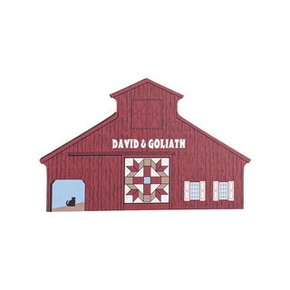 3/4" thick wooden illustration of a red barn with a quilt block on a white background
