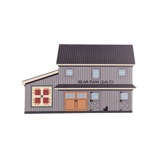 3/4" thick wooden illustration of a barn with a quilt block on a white background