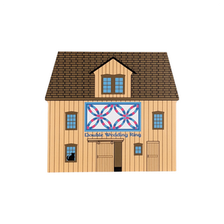 3/4" thick wooden illustration of a barn with a quilt