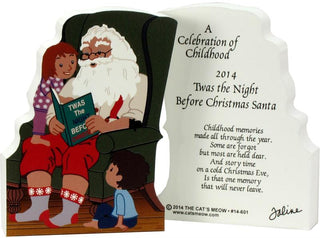 3/4" thick wooden replica with an Illustration of  Santa reading a book to children, featuring text and a signature.