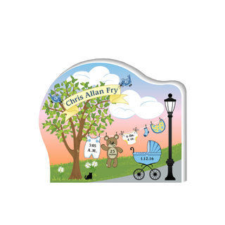 Wooden sign of a baby announcement with trees and flowers and baby things 