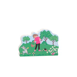 3/4" thick wooden replica with an illustration of a girl and dog in a garden with trees and flowers on a white background
