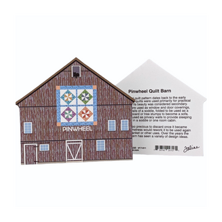 3/4" thick wooden illustration of a brown barn with a quilt and a 3/4" thick wooden model with text on a white background