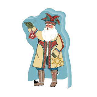 3/4" thick wooden replica with an Illustration of a festive Santa-like figure in a long cream coat with red trim, a red and green hat, white beard, and brown boots, holding a red ornament against a light blue cloud-shaped backdrop on a white background.