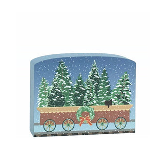 3/4" thick wooden replica with an illustration of a  train car with a wreath on a snowy landscape background