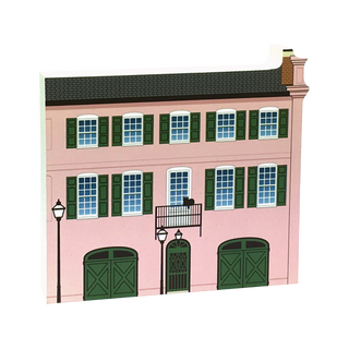 3/4" thick wooden Model of a pink building with green shutters and windows