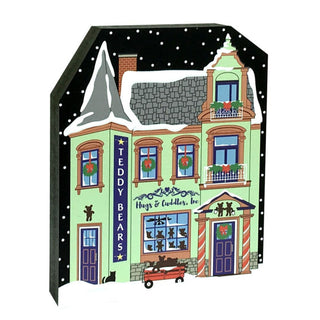 3/4" thick wooden replica with an illustration of a green victorian house with a sign that says teddy bears andhugs and cudddles inc 
