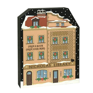 3/4" thick wooden replica with an illustration of a  'Nicholas Library' and Christmas decorations on a snowy background
