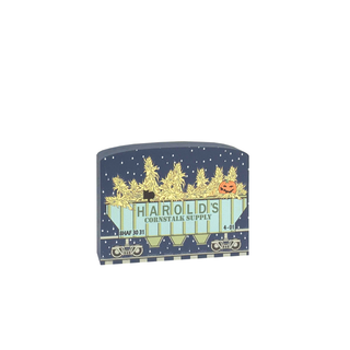 3/4" thick wooden cutout of Harold's Cornstalk Supply label with a festive design on a white background