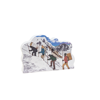 wooden replica with an Illustration of people hiking in a snowy mountain landscape