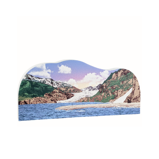 wooden replica with an illustration of  a mountain landscape with water and clouds