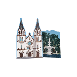 Illustration of a cathedral with two spires and a fountain in the background on a white background.