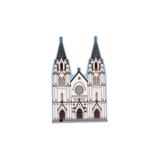 3/4" wooden replica with an illustration of a cathedral with two tall spires on a white background