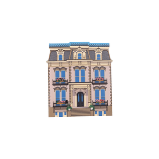 3/4" wooden replica with an illustration of  three story home with decorative accents and flower boxes 