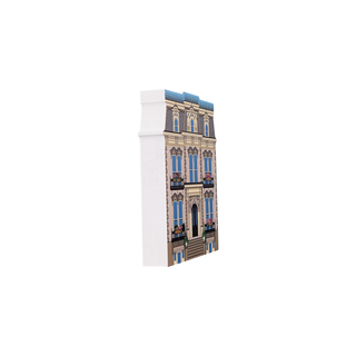 3/4" wooden replica with an illustration of of three story house with decorative accents with flower boxes on windows 