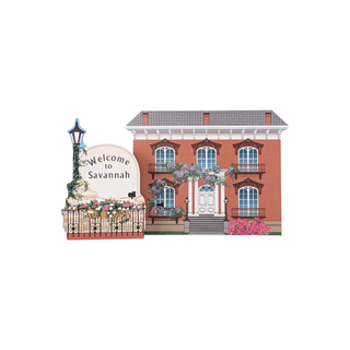 Illustration of a brick building with decorative elements and 'Welcome to Savannah' sign.