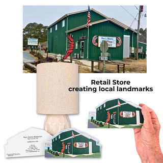 Green building with a sign, lamp, and small model of the building held by a hand.