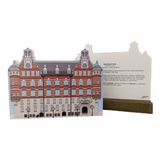 3/4" thick wooden cutout of  a building with descriptive text on a white background