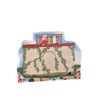 3/4" thick wooden replica with an illustration of a character in a red coat standing on a balcony with colorful railings.