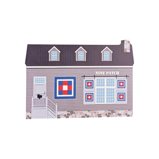 3/4" thick wooden illustration of a barn with quilt blocks