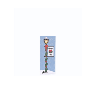 3/4" thick wooden illustration of a lamppost with Christmas decor