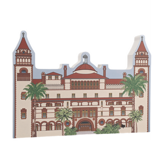 3/4" thick wooden illustration of a historic building with palm trees on a white background