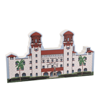 3/4" thick wooden illustration of a building with palm trees on a white background