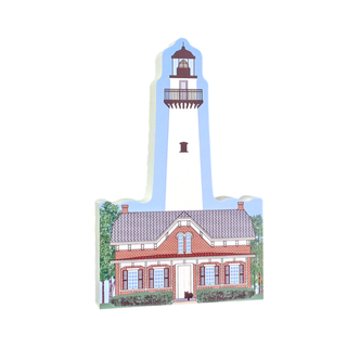 Illustration of a lighthouse with a brick building below on a white background